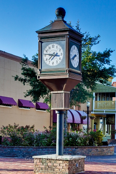 Magnolia Square IMG_6560a.jpg - Town Clock Sandford, FL The Town Clock originally hung on the First National Bank Building in 1931 before being moved a few times and finally incorporated into the new street scape.In 1985, Joe Oritt decided to have the clock restored as a gift to his wife and the city.The only original part of the clock visible today is the copper ball on top.